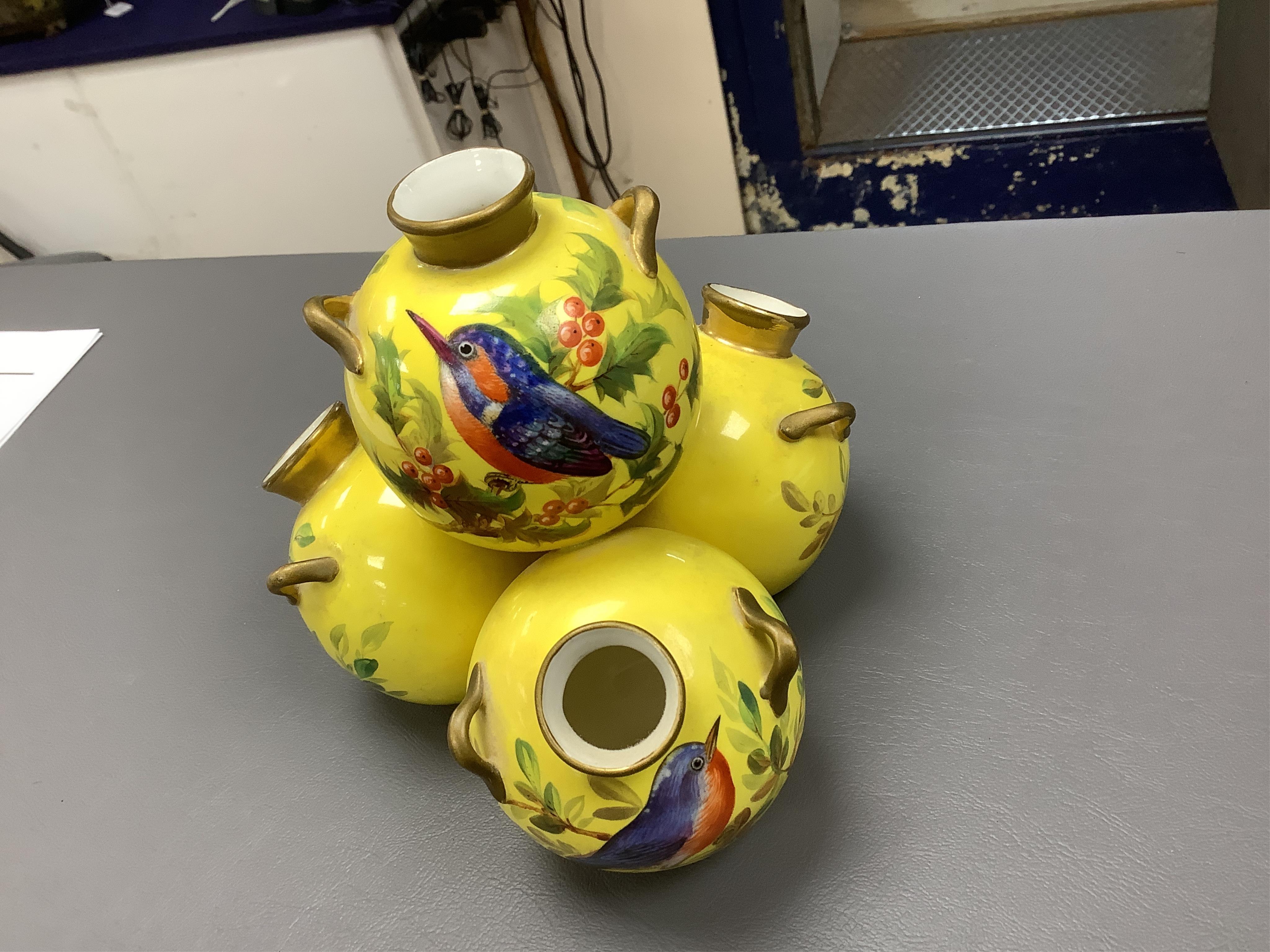 Three Royal Worcester 'pyramid' vases, painted with birds, 14cm high. Condition - fair/good